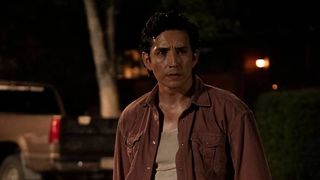 Tommy (Gabriel Luna) holding a rifle in The LAst Of Us