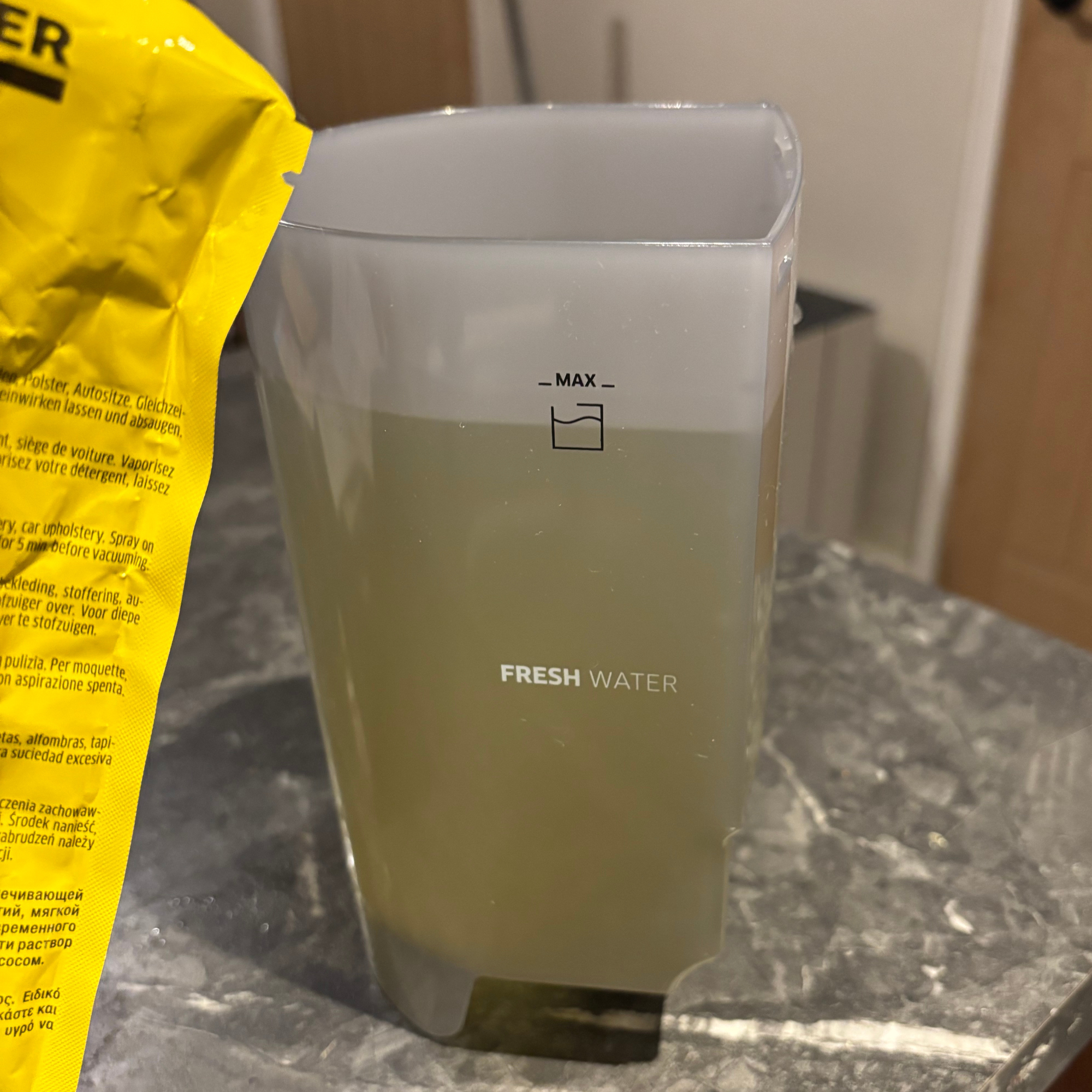 Karcher SE 2 Spot Care Spot Cleaner clean water tank filled with yellow cleaning detergent