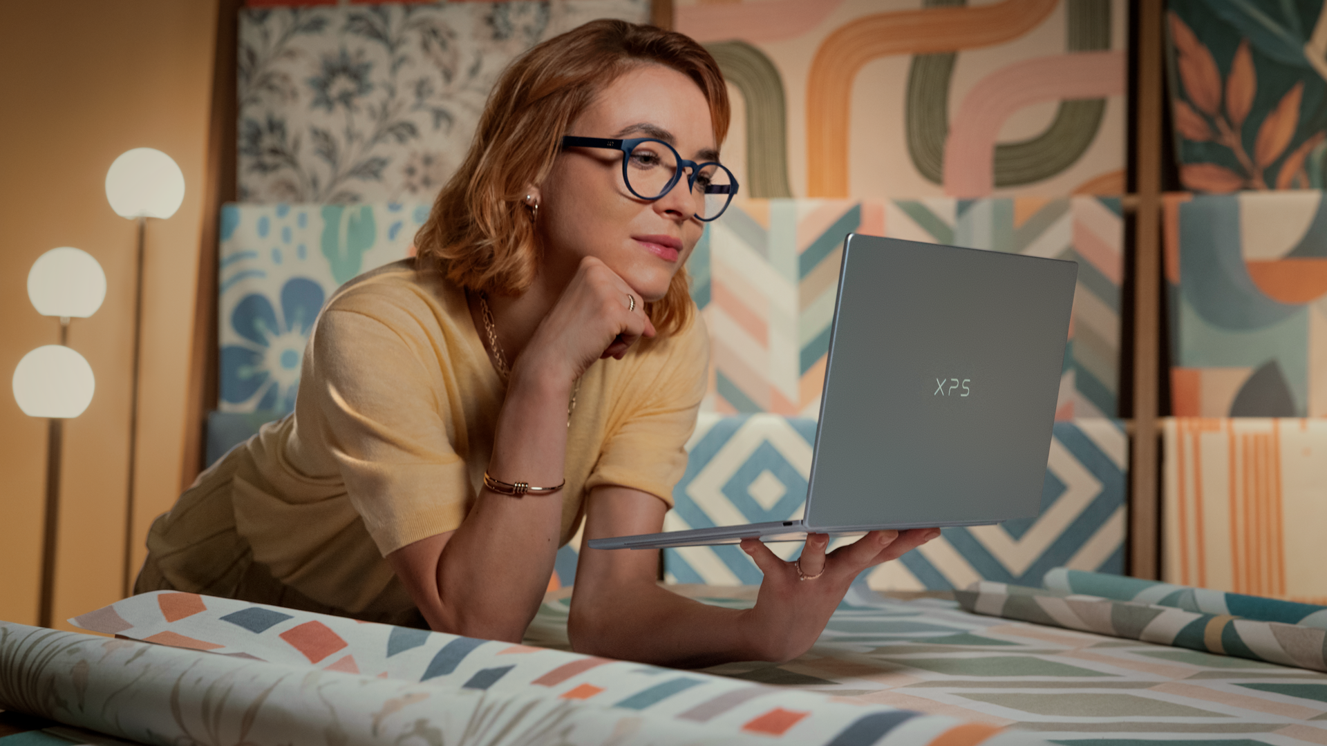 Dell XPS 14 being held in a person's hand showing how light it is