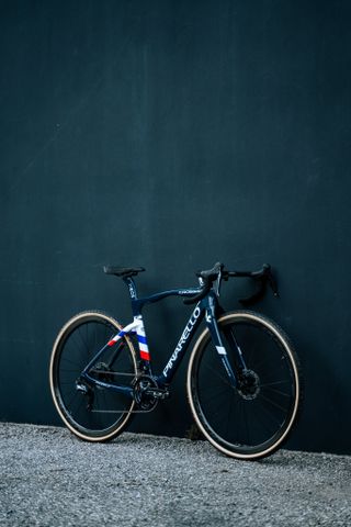 Pauline Ferrand-Prévot's Pinarello Crossista against a dark wall