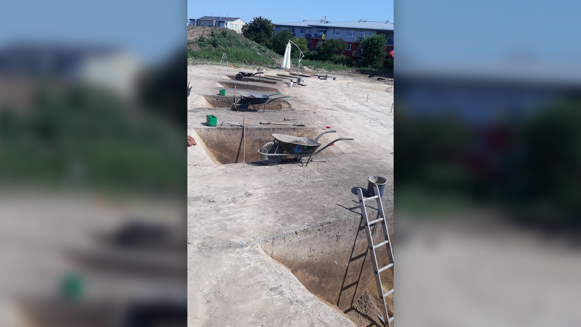 Open trenches undergoing excavation by a team from the Institute of Archaeology of the Czech Academy of Sciences.