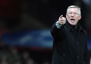 Manchester United manager Sir Alex Ferguson gestures during the second leg of their UEFA Champions League quarter final football match against AS Roma at Old Trafford in Manchester, north-west England, on April 9, 2008. Manchester United won the match 1-0. AFP PHOTO/STRINGER (Photo credit should read STRINGER/AFP via Getty Images)
