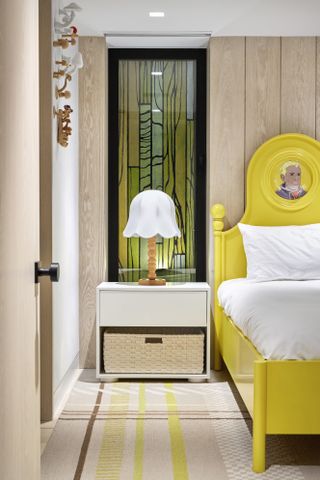 A bright yellow bed frame