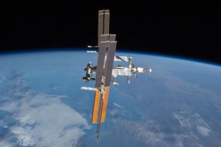 The International Space Station, as seen from the space shuttle Atlantis in July 2011, on the final flight of the shuttle program.