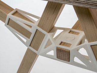 A detail of Studio Minale Maeda’s ’Keystones’ table, combining a wooden frame with 3D-printed joints