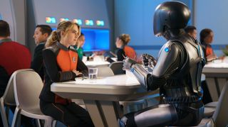 A still of Isaac the robot and crewmate on The Orville season 3.