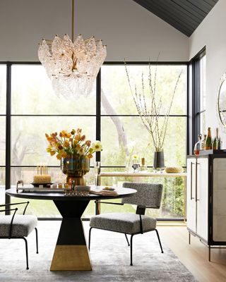 grey dining room with statement glass pendant lighting by Arteriors