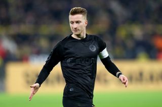 Marco Reus in action for Borussia Dortmund against Fortuna Duesseldorf in the club's centenary kit in December 2019.