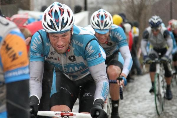 Milram riders sticking close to one another on a slippery climb
