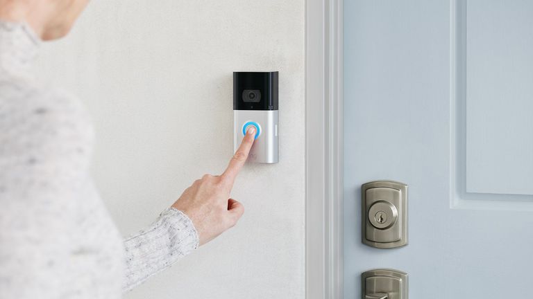 Best video doorbells 2022, image shows a white man pressing an Amazon Ring doorbell