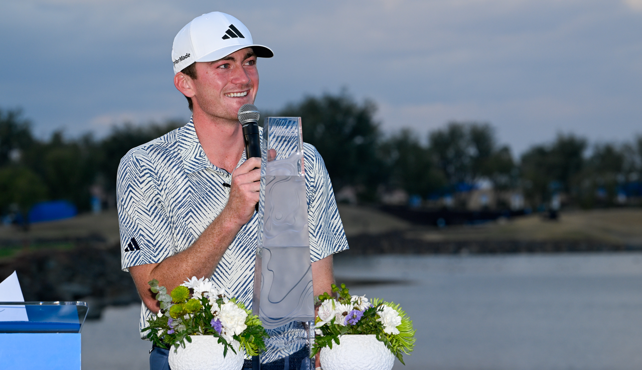 Nick Dunlap speaks into a microphone after his American Express victory