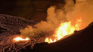 Kilauea volcano erupting at night inside the Halemaʻumaʻu crater. 