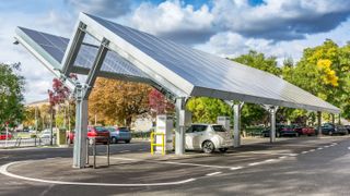 An electric car charging station with a solar roof