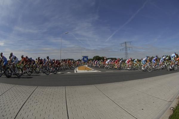 Riders part at a roundabout.