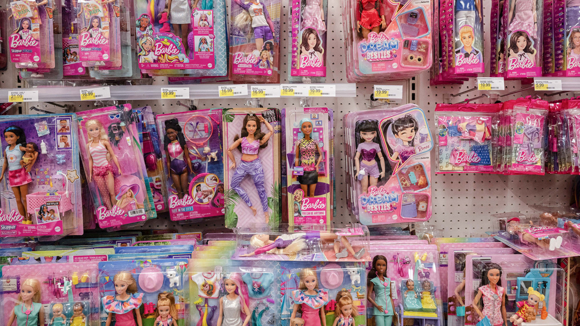 An aisle of dolls at a store 