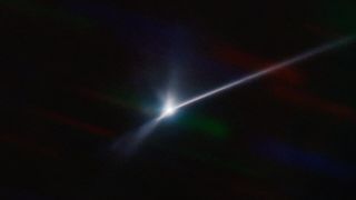 bright patch at center of image with long bright line to the right