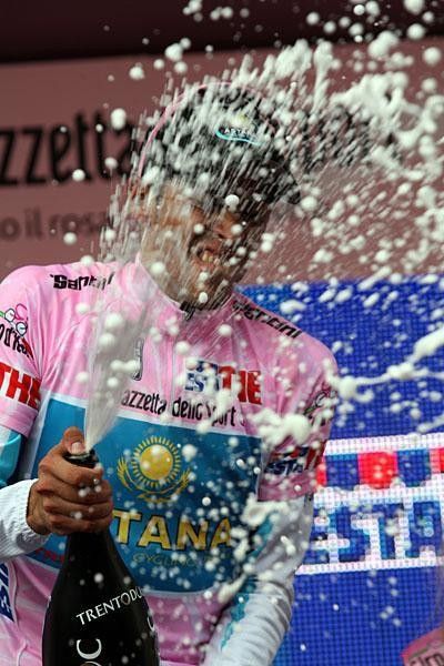 Contador perfects his champagne spray after five days in pink.
