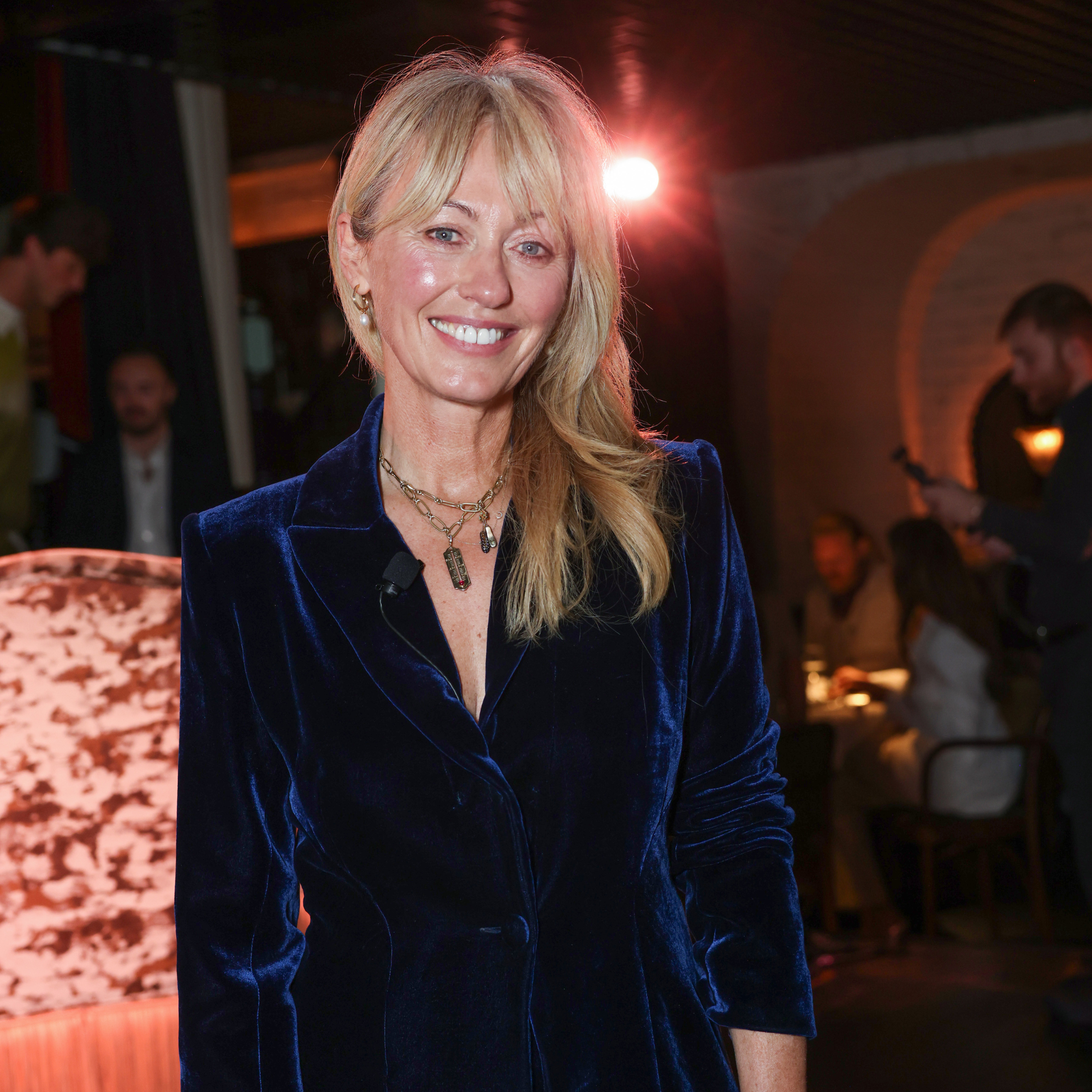 Clodagh McKenna smiling wearing a blue velvet suit at A Taste Of Royal Ascot 2025.