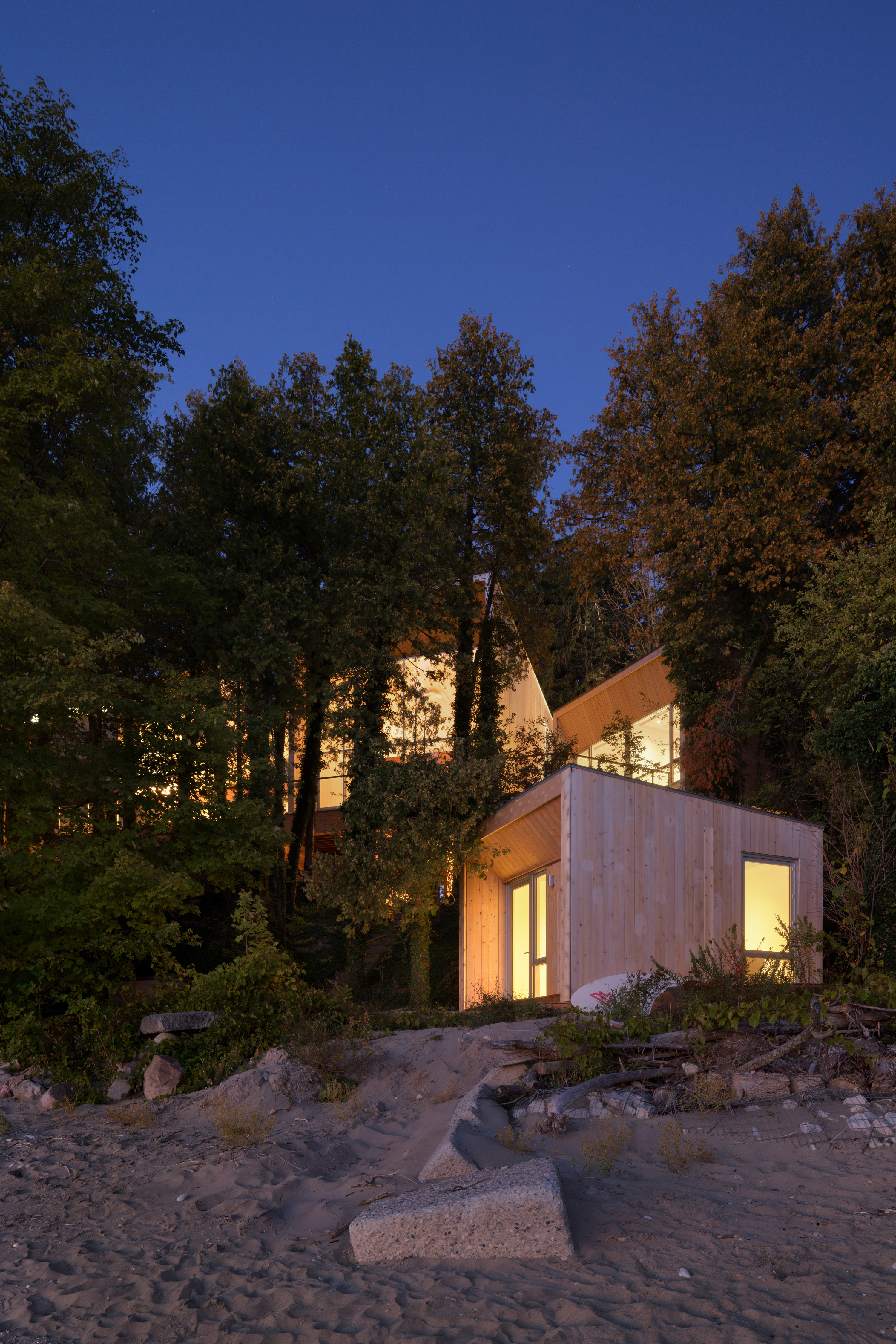 The house seen from the beach, with the cabin in the foreground
