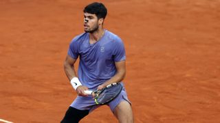 Carlos Alcaraz playing against Jannik Sinner in the Italian Open.