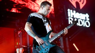 Chris Wolstenholme of Muse performs on stage during 2019 iHeartRadio ALTer Ego at The Forum on January 19, 2019 in Inglewood, California.