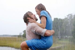 Rachel McAdams and ryan gosling embrace in the rain in "The Notebook"