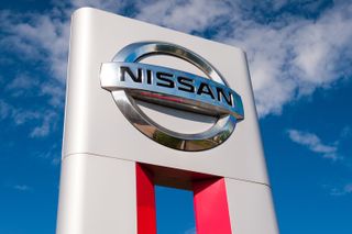 Nissan sign on a background of the sky
