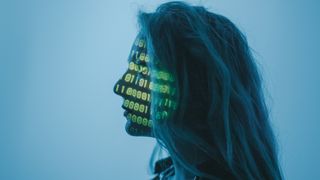 A woman with binary projected across her face