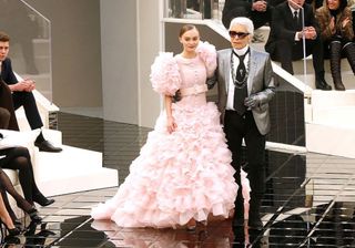 Lily Rose Depp closes the Chanel show alongside Karl Lagerfeld.