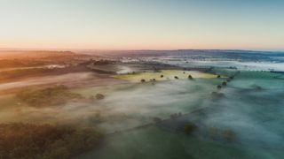 An aerial shot of green belt land