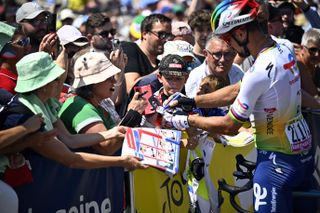 Peter Sagan signs autographs at the 2023 Tour de France