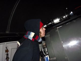 Journalist Howell Uses Telescope
