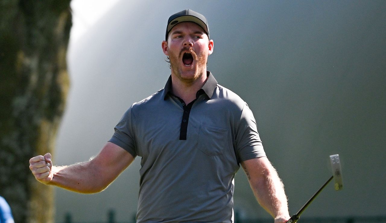 Grayson Murray fist pumps after holing the winning putt