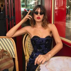 Jeanne Damas wearing red lipstick