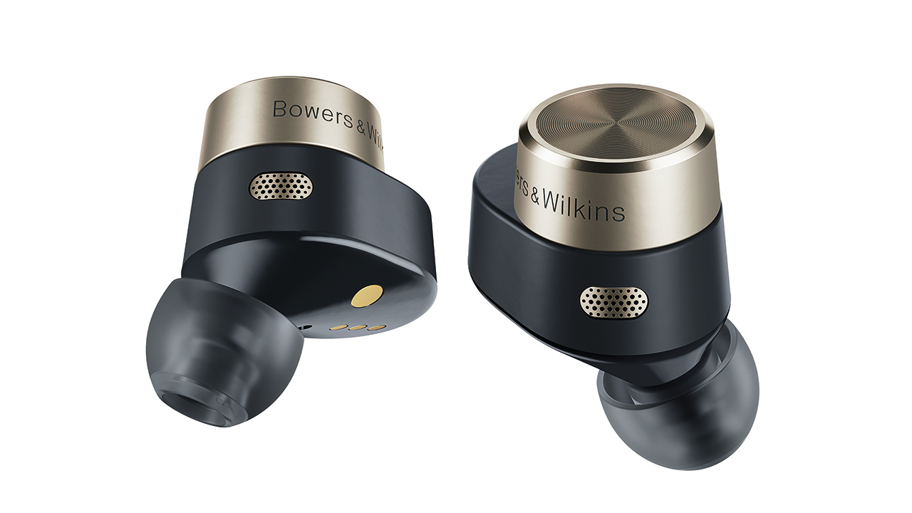 The bowers & wilkins pi7 truly wireless earbuds in black and gold with the eartips pointing downwards