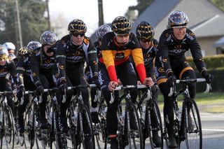 Jolien D'hoore's Belgian national champion jersey stands out against the black of her teammates