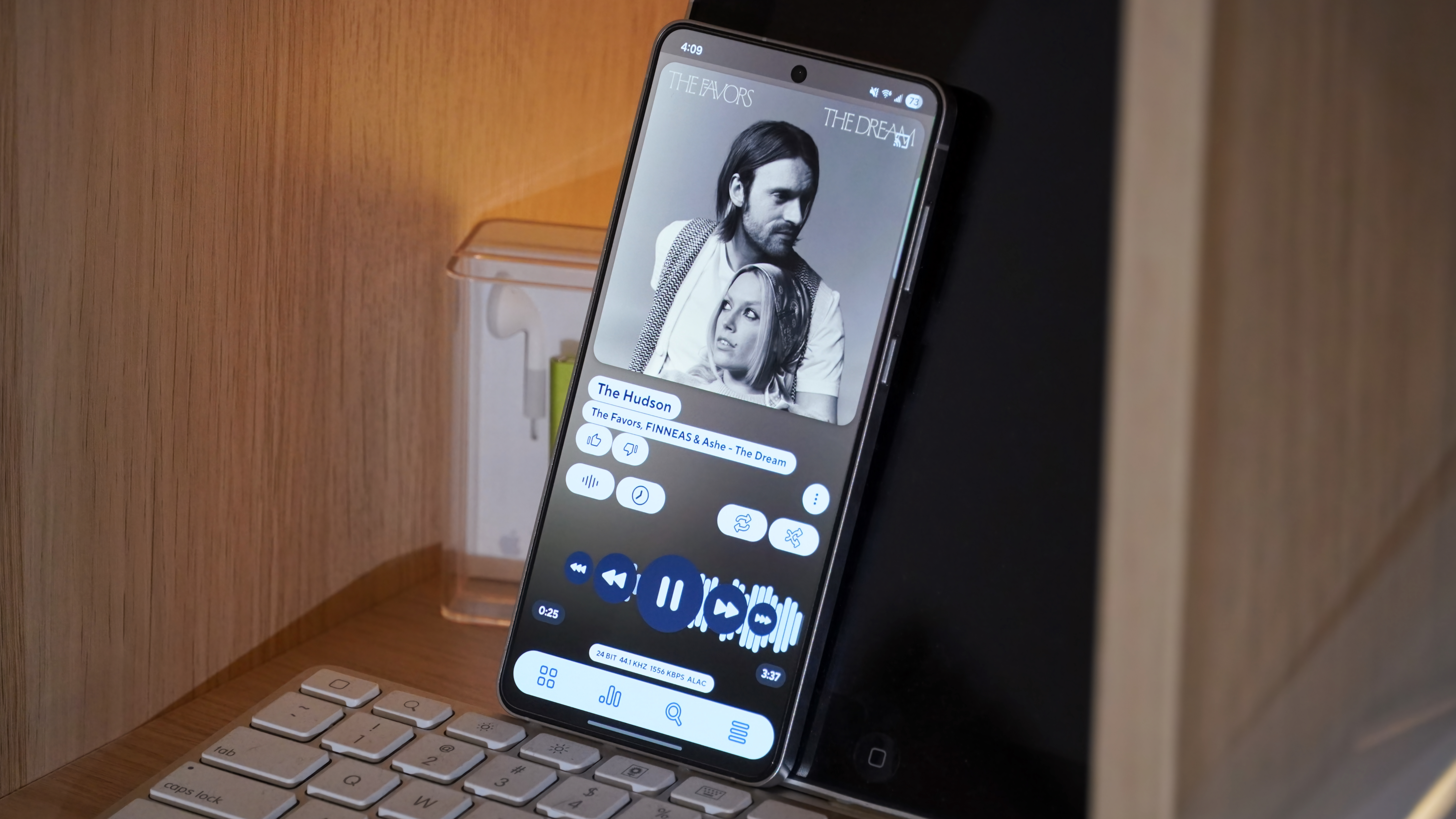 Music player apps running on various Android phones and iPhones.