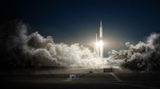 SpaceX will launch two paying passengers on a private flight around the moon in late 2018, the company's founder Elon Musk said Monday, Feb. 27, 2017. The mission would launch on a SpaceX Falcon Heavy seen here in this artist's illustration and take about