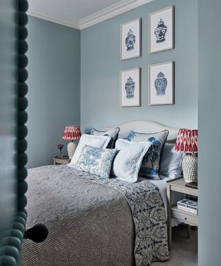 bedroom with blue walls and patterned bedspread