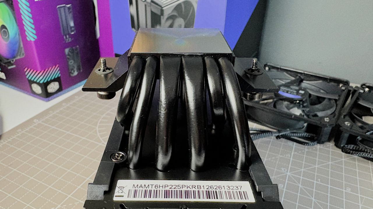 The Cooler Master V8 Ace 3DHP installed on a test bench and on its box.