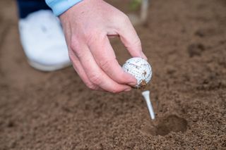 Identifying golf ball in sand