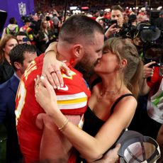 Travis Kelce and Taylor Swift embrace after the Kansas City Chiefs' Super Bowl win