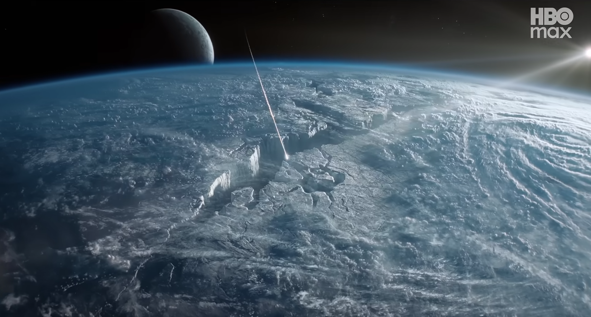 a meteor streaks into the crack in a planet