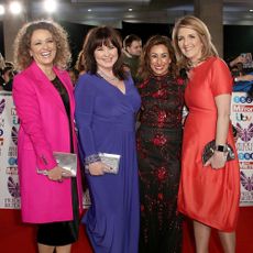 coleen nolan with friends with printed banner