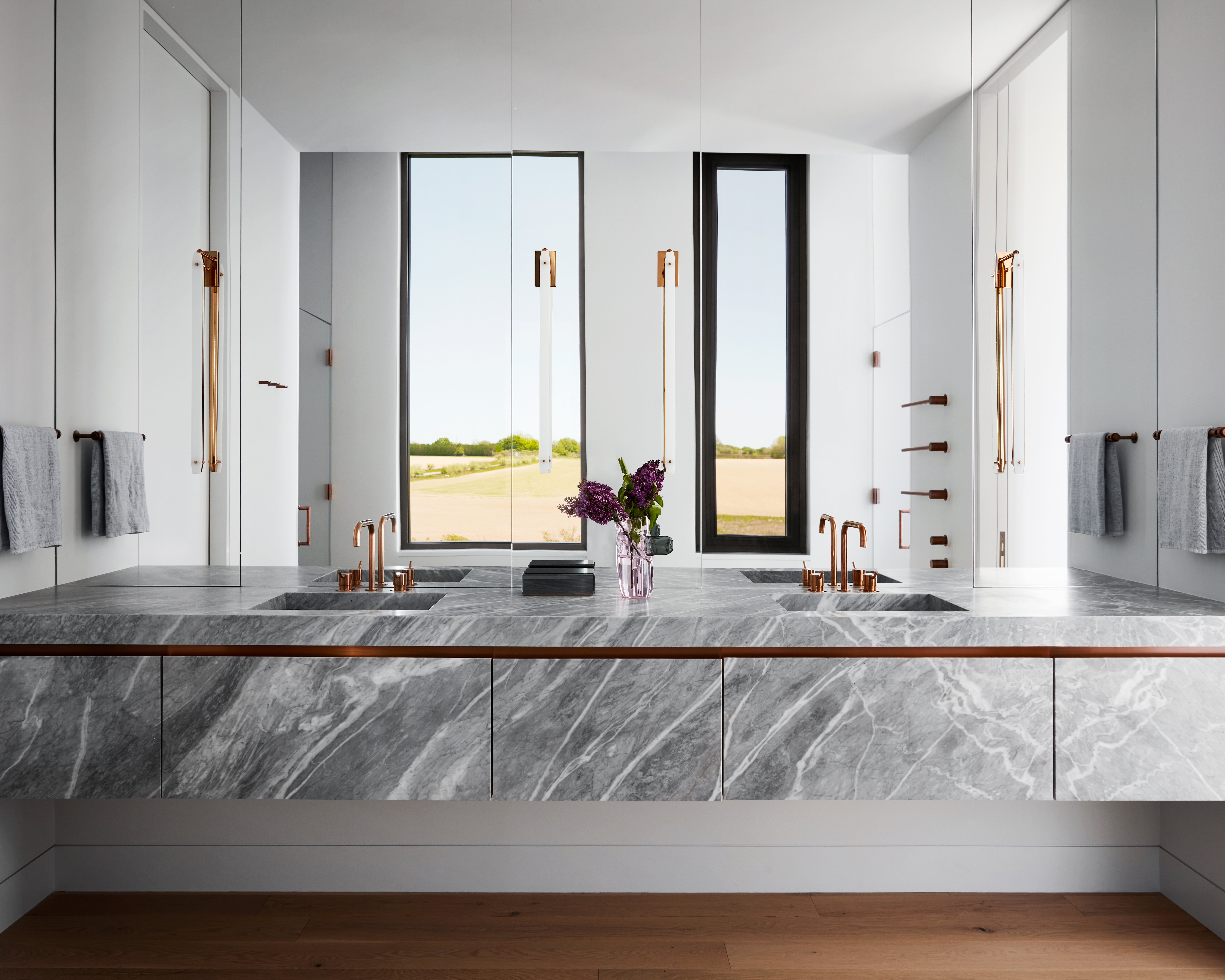 large white bathroom with large gray marble vanity unit