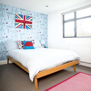 boys room with bed and wallpaper
