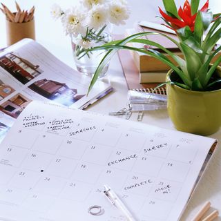 table with calendar and pen