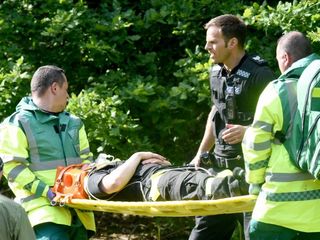 Jason Roscoe being taken to hospital after his fall