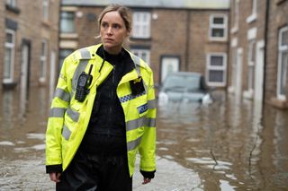 Sophie Rundle as PC Jo Marshall in flood water in After the Flood