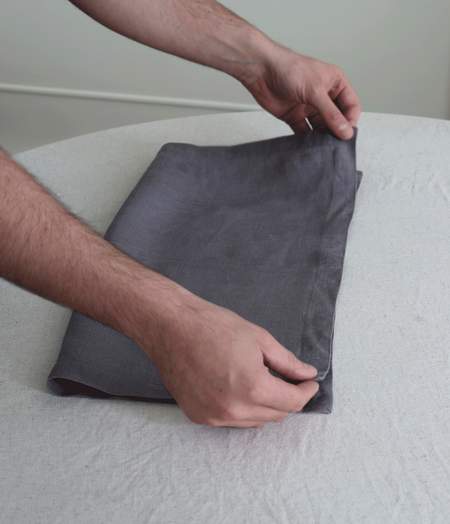 step by steps of folding a napkin into a christmas tree